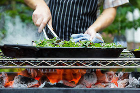 Kasey Mills of Toro Bravo cooks at Growing Gardens' Chef in My Garden fundraiser | © Matt Giraud Photography