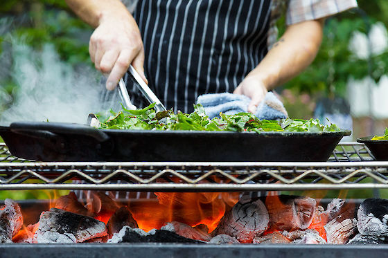 Kasey Mills of Toro Bravo cooks at Growing Gardens' Chef in My Garden fundraiser | © Matt Giraud Photography