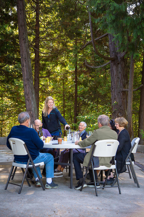 Winemaker Kelley Fox tastes visitors through her Pinot Noir and Pinot Blanc under a canopy of ancient cedars, Gaston, Oregon | © Matt Giraud Photography
