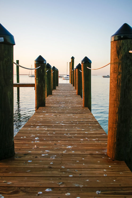 A jetty stretches out into golden hour in Key Largo, Florida | © Matt Giraud Photography